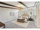 Bright main bedroom showcases exposed beams, large windows, and stylish furnishings at 645 Trailmore Pl, Roswell, GA 30076