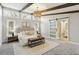 Spacious main bedroom features exposed wood beams, many windows, and ensuite bath at 645 Trailmore Pl, Roswell, GA 30076