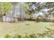 A spacious backyard with a storage shed and play structure offering a place for recreation at 1480 Bramlett Forest Se Trl, Lawrenceville, GA 30045