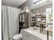 Cozy bathroom featuring a shower with a patterned curtain and modern sink at 1480 Bramlett Forest Se Trl, Lawrenceville, GA 30045