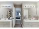 Well-lit Primary bathroom with double sinks and lots of room to get ready for the day at 1480 Bramlett Forest Se Trl, Lawrenceville, GA 30045