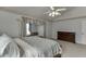 Inviting bedroom features a plush bed, ceiling fan, and neutral colors at 1480 Bramlett Forest Se Trl, Lawrenceville, GA 30045