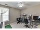 Bedroom with a ceiling fan, white trim, and space to be used as a home office at 1480 Bramlett Forest Se Trl, Lawrenceville, GA 30045