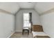 Neutral bedroom with a daybed and a window providing natural light at 1480 Bramlett Forest Se Trl, Lawrenceville, GA 30045