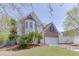Lovely two-story home featuring a two-car garage, landscaped lawn, and inviting curb appeal at 1480 Bramlett Forest Se Trl, Lawrenceville, GA 30045