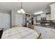 View of eat-in kitchen showing table, white cabinets, and stainless steel appliances at 1480 Bramlett Forest Se Trl, Lawrenceville, GA 30045