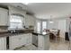 Bright kitchen with white cabinets, granite countertops, and stainless steel appliances at 1480 Bramlett Forest Se Trl, Lawrenceville, GA 30045
