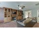 Cozy living room with built-in bookshelves, fireplace, and comfortable seating arrangement at 1480 Bramlett Forest Se Trl, Lawrenceville, GA 30045