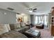 Spacious living room with cozy seating and neutral tones, perfect for relaxing or entertaining at 1480 Bramlett Forest Se Trl, Lawrenceville, GA 30045