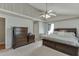 Bright main bedroom boasting high ceilings, large bed, and wooden furniture at 1480 Bramlett Forest Se Trl, Lawrenceville, GA 30045