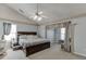 Spacious bedroom with a ceiling fan, neutral colors, and natural light at 1480 Bramlett Forest Se Trl, Lawrenceville, GA 30045