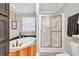 Bathroom showcases a corner tub with wood paneling and a glass-enclosed shower at 2466 Monroe Jersey Rd, Covington, GA 30014