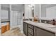 Bright bathroom featuring a tub, a shower, and a double sink vanity with granite countertops at 2466 Monroe Jersey Rd, Covington, GA 30014