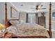 Comfortable bedroom with four-poster bed, ceiling fan, and soft lighting at 2466 Monroe Jersey Rd, Covington, GA 30014