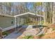 Carport providing covered parking with gravel driveway and surrounded by natural landscape at 2466 Monroe Jersey Rd, Covington, GA 30014