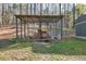 Chicken coop built with metal framing and wire mesh on a grass lawn at 2466 Monroe Jersey Rd, Covington, GA 30014
