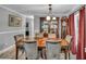 Elegant dining room with wood table, china cabinet, and natural light at 2466 Monroe Jersey Rd, Covington, GA 30014