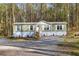 Charming single-story home with a lush, wooded backdrop and well-maintained front yard at 2466 Monroe Jersey Rd, Covington, GA 30014