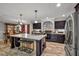 Large island in the kitchen, stainless appliances, and dark cabinetry at 2466 Monroe Jersey Rd, Covington, GA 30014
