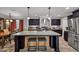 Spacious kitchen with a granite-topped island, stainless steel appliances, and dark cabinetry at 2466 Monroe Jersey Rd, Covington, GA 30014