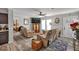 Bright living room with hardwood floors, TV, and comfortable seating arrangement at 2466 Monroe Jersey Rd, Covington, GA 30014