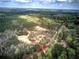 Expansive aerial view showcasing the homes, lush surrounding forest, and the neighborhood at 313 Morgan Rd, Temple, GA 30179
