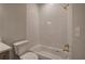 Bright bathroom showcasing a bathtub with white tiled walls and a gold shower head and faucet at 313 Morgan Rd, Temple, GA 30179