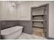 Bathroom featuring a soaking tub with view of walk-in closet at 313 Morgan Rd, Temple, GA 30179