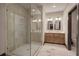 Modern bathroom featuring a glass shower and dual sinks at 313 Morgan Rd, Temple, GA 30179