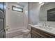 Bright bathroom showcasing a tub shower combo with white tile, and a vanity with marble countertop at 313 Morgan Rd, Temple, GA 30179