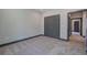 Neutral bedroom featuring carpet, baseboard trim and gray closet doors at 313 Morgan Rd, Temple, GA 30179