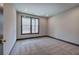Bright bedroom featuring carpet, baseboard trim and a window overlooking the outdoors at 313 Morgan Rd, Temple, GA 30179