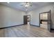 Spacious bedroom with wood floors, ceiling fan, and ensuite bathroom with soaking tub at 313 Morgan Rd, Temple, GA 30179