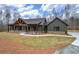 Charming exterior featuring a wooden frame porch and landscaped front yard at 313 Morgan Rd, Temple, GA 30179