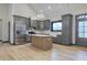 Modern kitchen with gray cabinets and a kitchen island at 313 Morgan Rd, Temple, GA 30179