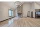 Open living room with hardwood floors and a stone fireplace at 313 Morgan Rd, Temple, GA 30179