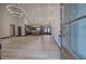 Bright, open-concept living area featuring hardwood floors, high ceilings, modern chandeliers, and a spacious kitchen at 313 Morgan Rd, Temple, GA 30179