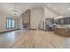 Bright open floor plan with a stone fireplace and modern gray kitchen at 313 Morgan Rd, Temple, GA 30179