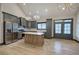 Spacious living area with stainless steel appliances, gray cabinets, and hardwood floors at 313 Morgan Rd, Temple, GA 30179