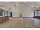 Open living space featuring hardwood flooring, high ceilings, and modern lighting fixtures at 313 Morgan Rd, Temple, GA 30179