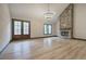 Spacious living room with stone fireplace and wood-framed double door at 313 Morgan Rd, Temple, GA 30179