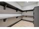 Large walk-in closet with built-in shelving and ample storage space at 313 Morgan Rd, Temple, GA 30179