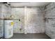 Basement with brick walls and water heater at 3932 Lindsey Dr, Decatur, GA 30035