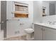 Bathroom featuring a gray vanity, subway tile surround, and tiled flooring at 3932 Lindsey Dr, Decatur, GA 30035
