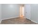 A cozy bedroom featuring wood-look flooring and white trim at 3932 Lindsey Dr, Decatur, GA 30035