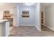 Dining area with updated floors open to the kitchen at 3932 Lindsey Dr, Decatur, GA 30035