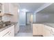 Bright kitchen featuring white cabinetry, granite countertops, and stainless steel sink at 3932 Lindsey Dr, Decatur, GA 30035