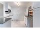 Well-lit kitchen featuring white cabinets, granite countertops, and stainless steel appliances at 3932 Lindsey Dr, Decatur, GA 30035