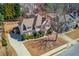 Beautiful home featuring manicured landscaping, a long driveway, and a well-maintained lawn at 4155 Cami Way, Buford, GA 30519