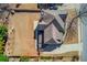 Aerial view of the property with a well-maintained roof, spacious yard, and mature trees at 4155 Cami Way, Buford, GA 30519